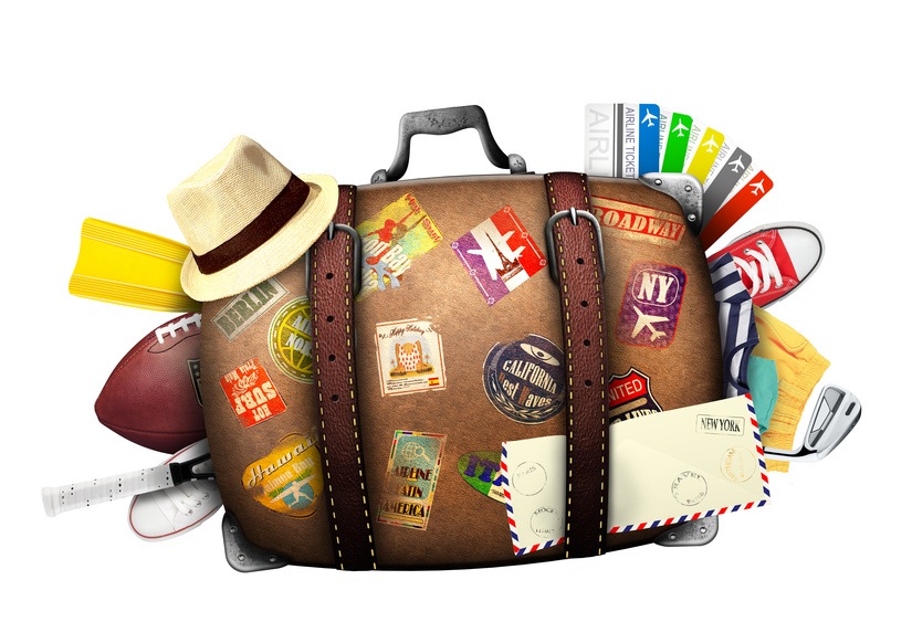 Full suitcase of a traveler with travel stickers